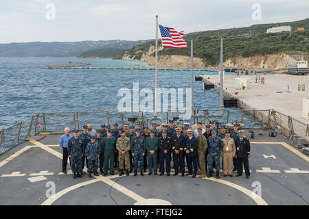 SOUDA BAY, Greece (Dec. 3, 2014) – Participants of the multinational maritime exercise, Phoenix Express 2015, pose for a photo aboard USS Cole (DDG 67). Cole, an Arleigh Burke-class guided-missile destroyer, homeported in Norfolk, is conducting naval operations in the U.S. 6th Fleet area of operations in support of U.S. national security interests in Europe. Stock Photo