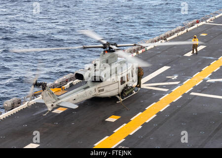 ATLANTIC OCEAN (Dec. 22, 2014) An AH-1W Super Cobra from Marine Medium Tiltrotor Squadron 365 (Reinforced) participates in flight operations on the flight deck of the Wasp-class amphibious assault ship USS Iwo Jima (LHD 7) Dec. 22, 2014. Iwo Jima, deployed as part of the Iwo Jima Amphibious Ready Group/24th Marine Expeditionary Unit, is conducting naval operations in the U.S. 6th Fleet area of operations in support of U.S. national security interests in Europe. (U.S. Navy photo by Mass Communication Specialist Seaman Shelby M. Tucker/ Released) Stock Photo