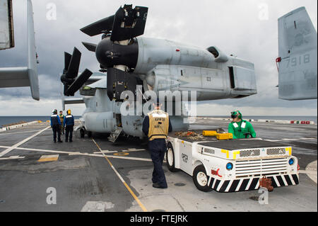 MEDITERRANEAN SEA (Dec. 27, 2014) Sailors aboard the San Antonio-class amphibious transport dock ship USS New York (LPD 21) reposition an MV-22B Osprey on the flight deck in preparation for flight operations Dec. 26, 2014. New York, part of the Iwo Jima Amphibious Ready Group/24th Marine Expeditionary Unit, is conducting naval operations in the U.S. 6th Fleet area of operations in support of U.S. national security interests in Europe Stock Photo