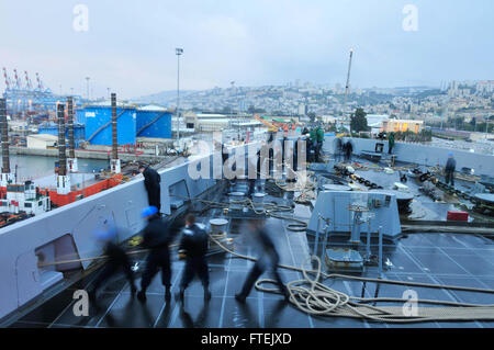 HAIFA, Israel (Jan. 4, 2015) Sailors aboard the San Antonio-class transport dock ship USS New York (LPD 21) prepare to get the ship underway from Haifa, Isareal, Jan. 4, 2015. New York is deployed as part of the Iwo Jima Amphibious Ready Group/24th Marine Expeditionary Unit (IWO ARG/24MEU) in support of maritime security operations (MSO) and theater security cooperation efforts in the U.S. 6th and 5th Fleet areas of operation Along with New York, the Iwo Jima ARG/24 MEU is comprised of embarked Marines from the 24th MEU, the multi-purpose amphibious assault ship USS Iwo Jima Stock Photo