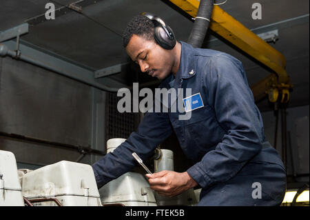 150108-N-XG464-123 MEDITERRANEAN SEA (Jan. 8, 2015) Engineman 3rd Class Kevin Fields, a Fort Wayne, Indiana native, stationed aboard the San Antonio-class amphibious transport dock ship USS New York (LPD 21), conducts maintenance on one of the Ship's Service Diesel Engines in Auxiliary Machinery Room 1, while underway on a routine deployment Jan. 8, 2015. New York, deployed as part of the Iwo Jima Amphibious Ready Group/24th Marine Expeditionary Unit, is conducting naval operations in the U.S. 6th Fleet area of operations in support of U.S. national security interests in Europe. (U.S. Navy pho Stock Photo