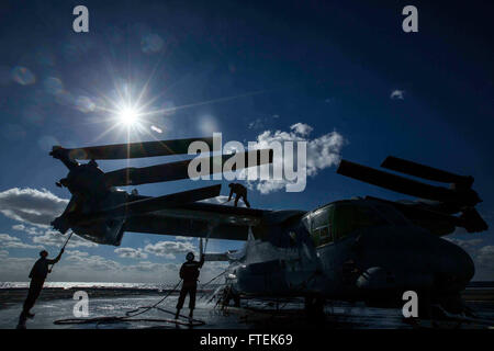 150109-M-YH418-002 MEDITERRANEAN SEA (Jan. 9, 2015) Marines with Marine Medium Tiltrotor Squadron 365 (Reinforced), 24th Marine Expeditionary Unit (MEU), perform a freshwater cleaning of an MV-22B Osprey aboard the San Antonio-class amphibious transport dock ship USS New York (LPD 21) Jan. 9, 2015. The 24th MEU and Iwo Jima Amphibious Ready Group are conducting naval operations in the U.S. 6th Fleet area of operations in support of U.S. national security interests in Europe. (U.S. Marine Corps photo by Cpl. Todd F. Michalek/Released) Stock Photo