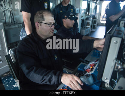 150119-N-ZZ999-285 MEDITERRANEAN SEA (Jan. 19, 2015) Chief Gunner’s Mate Adam Harlan, from Charlotte, North Carolina, participates in a live-fire exercise aboard USS Donald Cook (DDG 75) Jan. 19, 2015. Donald Cook, an Arleigh Burke-class guided-missile destroyer, forward-deployed to Rota, Spain, is conducting naval operations in the U.S. 6th Fleet area of operations in support of U.S. national security interests in Europe. (U.S. Navy photo by Seaman Recruit Alexis Smith/Released) Stock Photo
