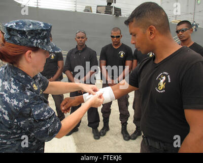 Chief Hospital Corpsman, United States Fleet Marine Forces, Jessica Zugzda  steams a dress Navy uniform in the uniform shop of the Air Force Mortuary  Affairs Operations center at Dover Air Force Base