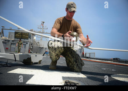 ATLANTIC OCEAN (Feb. 10, 2015) Information Technology Specialist 2nd Class Joshua Lesperance, from Spring Valley, Illinois, conducts routine maintenance on the RQ-20A  Aqua Puma small unmanned aircraft system aboard the Military Sealift Command's joint high-speed vessel USNS Spearhead (JHSV 1) Feb. 10, 2015. Spearhead is on a scheduled deployment to the U.S. 6th Fleet area of operations in support of the international collaborative capacity-building program Africa Partnership Station (APS). (U.S. Navy photo by Mass Communication Specialist 1st Class Joshua Davies/Released) Stock Photo