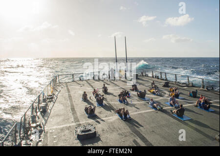ATLANTIC OCEAN (Feb. 19, 2015) Sailors aboard USS Laboon (DDG 58) perform sit-ups during command physical training on the flight deck Feb. 19, 2015. Laboon, an Arleigh Burke-class guided-missile destroyer home ported in Norfolk, is underway conducting naval operations in the U.S. 6th Fleet area of operations in support of U.S. national security interests in Europe. Stock Photo