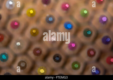 Coloured pencil background. Pencil crayons in hexagonal pattern with colored points in focus in this artistic background Stock Photo