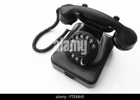 Old telephone isolated on white background , black and white Stock Photo