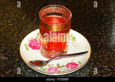 Tea in decorated glass Stock Photo