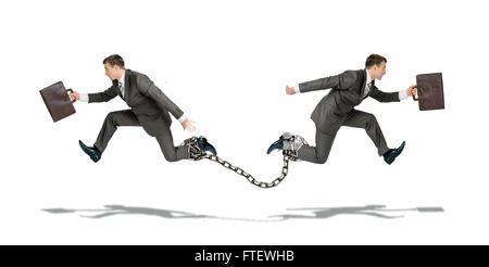 Two businessmen running in different ways Stock Photo