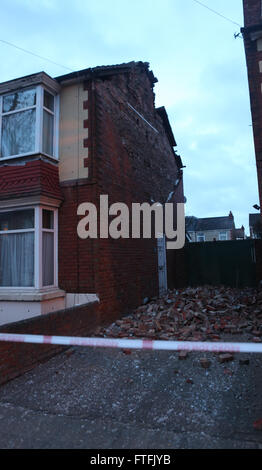 Portsmouth, Hampshire, UK. 28th March, 2016.  Storm Katie hit the South Coast with wind speed recorded of over 109 mph.  Overnight, there was some disruption and a lot of wind damage has been reported due to winds of up to 106 mph recorded on Needles on the Isle of Wight    This  Portsmouth Street is cordoned off after the gable end collapsed on the property  just after 2am  Two fire crews from Southsea fire station in Portsmouth attended and made safe a roof in a dangerous condition in Copnor Credit:  uknip/Alamy Live News Stock Photo