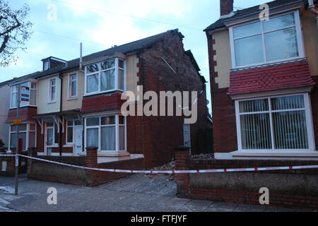 Portsmouth, Hampshire, UK. 28th March, 2016.  Storm Katie hit the South Coast with wind speed recorded of over 109 mph.  Overnight, there was some disruption and a lot of wind damage has been reported due to winds of up to 106 mph recorded on Needles on the Isle of Wight    This  Portsmouth Street is cordoned off after the gable end collapsed on the property  just after 2am  Two fire crews from Southsea fire station in Portsmouth attended and made safe a roof in a dangerous condition in Copnor Credit:  uknip/Alamy Live News Stock Photo