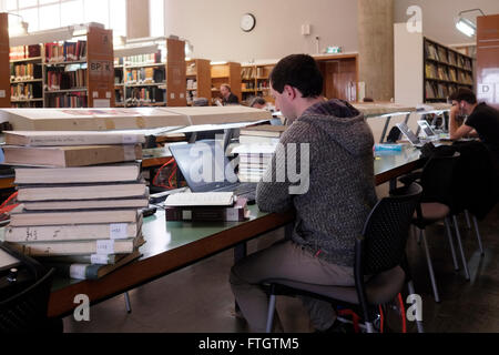 The reading room in Israel's National Library on the Givat Ram campus of the Hebrew University of Jerusalem on 28 March 2016. The National Library of Israel is the library dedicated to collecting the cultural treasures of Israel and of Jewish heritage. Student at the library holds more than 5 million books, and owns the world's largest collections of Hebraica and Judaica, and is the repository of many rare and unique manuscripts, books and artifacts. Stock Photo