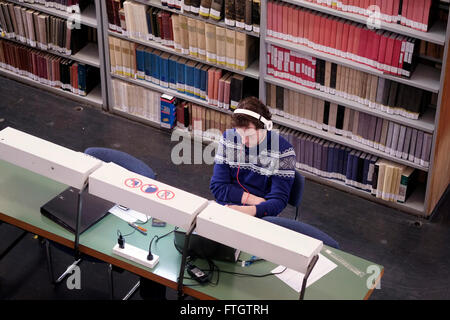 A student at the reading room in Israel's National Library on the Givat Ram campus of the Hebrew University of Jerusalem on 28 March 2016. The National Library of Israel is the library dedicated to collecting the cultural treasures of Israel and of Jewish heritage. The library holds more than 5 million books, and owns the world's largest collections of Hebraica and Judaica, and is the repository of many rare and unique manuscripts, books and artifacts. Stock Photo