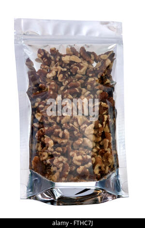 Walnuts in packaging foil zip lock bag. Isolated on white with clipping paths. Stock Photo