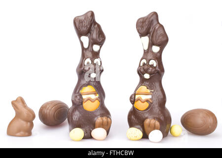 Easter chocolate Bunnies and sweet chocolate eggs on white background Stock Photo