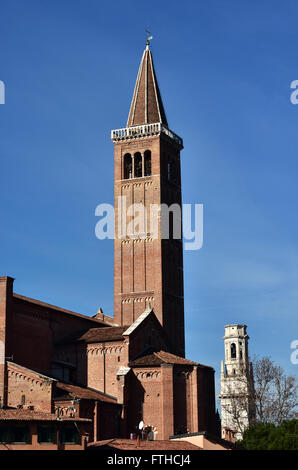 Sant'Anastasia red brick belfry with Verona Cathedral marble belfry Stock Photo