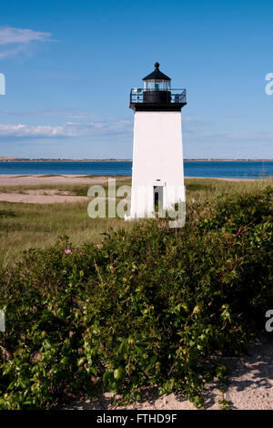 Long Point lighthouse overlooks Provincetown Harbor on the tip of Cape Cod on a warm summer afternoon. Stock Photo