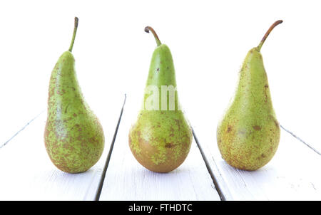 Green Pears on white rustic wooden table Stock Photo