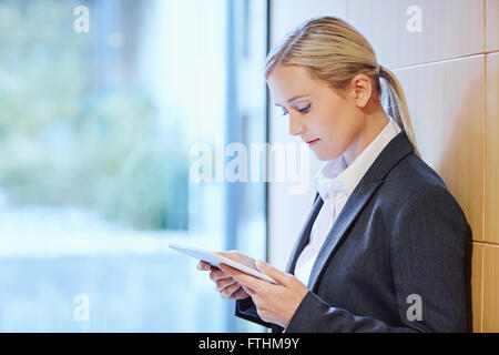 Reading an article online Stock Photo