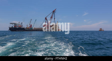 Oil rig lifting for installation on its jacket Stock Photo