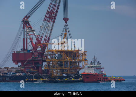 Oil rig lifting for installation on its jacket Stock Photo