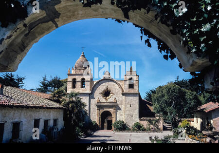 The Basilica Church of Mission San Carlos Borromeo de Carmelo was founded in 1771 by Father Junipero Serra  in what is now Carmel, California, USA. The fabled Spanish priest who was a Franciscan friar became a Catholic saint when canonized by Pope Francis in September, 2015. The Carmel mission was the second of 21 California missions established up and down the state; it was one of nine founded by Saint Serra. He died there in1784 at the age of 70 and is buried under the sanctuary floor. Stock Photo