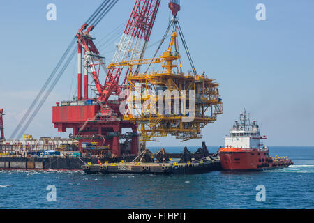 Oil rig lifting for installation on its jacket Stock Photo