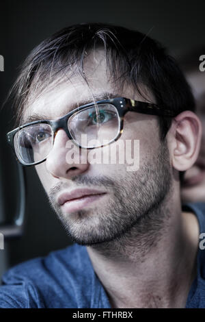 Portrait of young handsome man wearing stylish eyeglasses Stock Photo