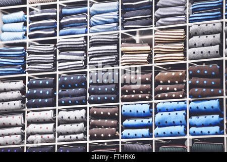 Vintage shot with different silk neckties packed on shelves in a store Stock Photo