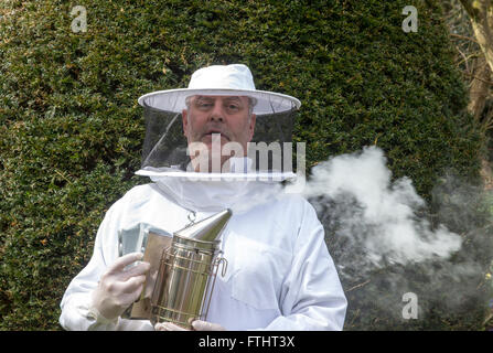 Portrait of a beekeeper with smoker Stock Photo