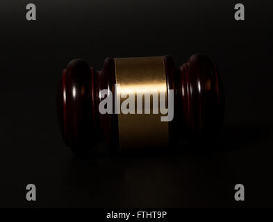 wooden judge gavel on black background Stock Photo
