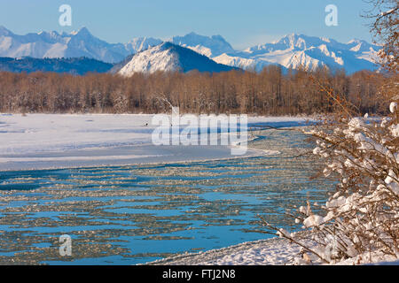 Landscape of river and mountain covered with snow, Haines, Alaska, USA Stock Photo