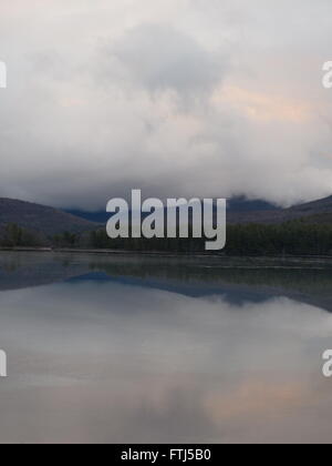 Lake in late afternoon with clouds Stock Photo