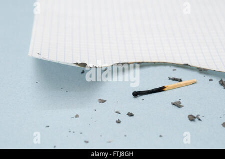 Match and burnt paper Stock Photo