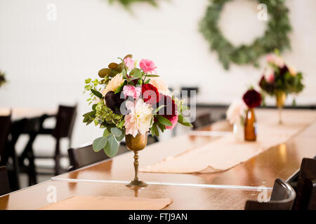 Flower centerpieces on a table on natural lightning conditions Stock ... Flower centerpieces on a table on natural lightning conditions Stock ...