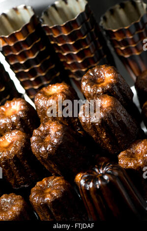 Cake canneles, french dessert in a bakery Stock Photo