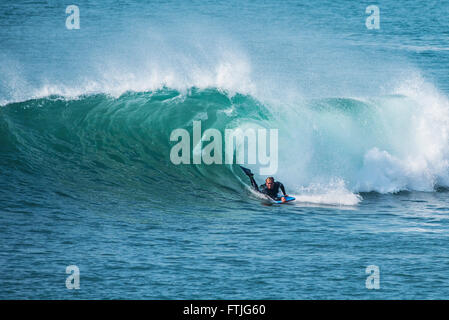 A body boarder surfs at Porthleven in Cornwall. Stock Photo