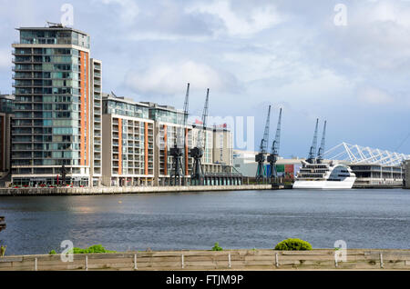 Looking across The Royal Victoria Dock at hotels with the London Excel Centre in the background. Stock Photo