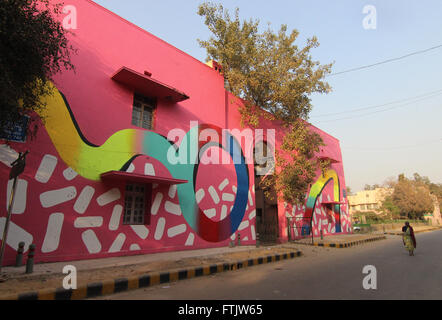 New Delhi, India. 14th Feb, 2016. A woman passes a mural in the open air gallery at Lodhi Colony in New Delhi, India, 14 February 2016. More than 25 artists from around the world have painted the walls of the district, as part of the annual Street Art Festival organised by Indial organisation ST ART. PHOTO: DOREEN FIEDLER/DPA/Alamy Live News Stock Photo