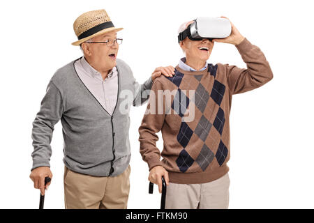 Two senior gentlemen using a VR headset isolated on white background Stock Photo