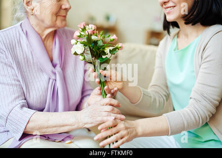Giving fresh roses Stock Photo
