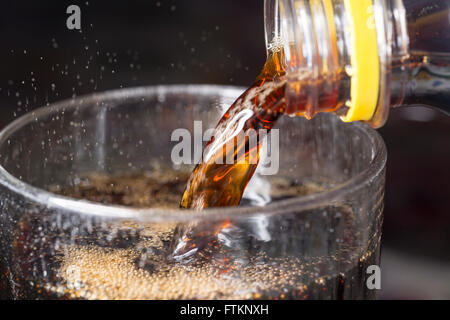 Soda Pouring into Glass Close up Stock Photo