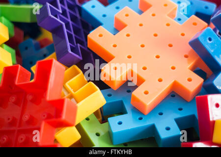 Colorful plastic jigsaw puzzle game, stock photo Stock Photo