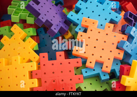 Colorful plastic jigsaw puzzle game, stock photo Stock Photo