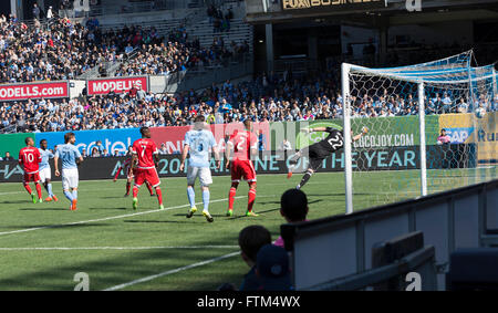 New York, NY USA - March 26, 2016: Bobby Shuttleworth (22) saves goal during New York City FC against New England Revolution match at Yankee Stadium Stock Photo