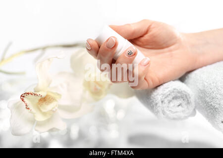 How to make a pattern on your nails? black and white manicure . Beauty salon, manicure, woman to a beautician for manicure Stock Photo