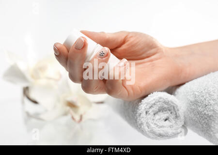 How to make a pattern on your nails? black and white manicure . Beauty salon, manicure, woman to a beautician for manicure Stock Photo