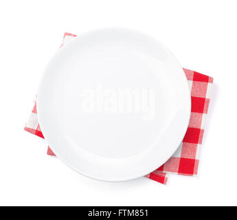 Empty plate over kitchen towel. Top view. Isolated on white background Stock Photo