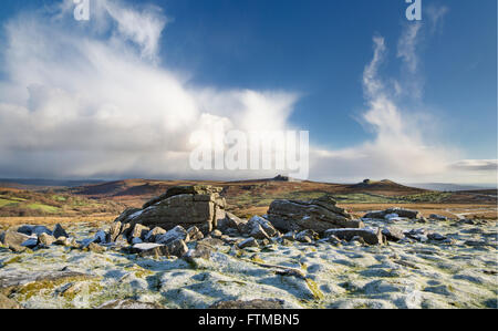 View from Top Tor to Haytor and Saddle Tor on Dartmoor on a winter’s morning with dusting of snow. Stock Photo